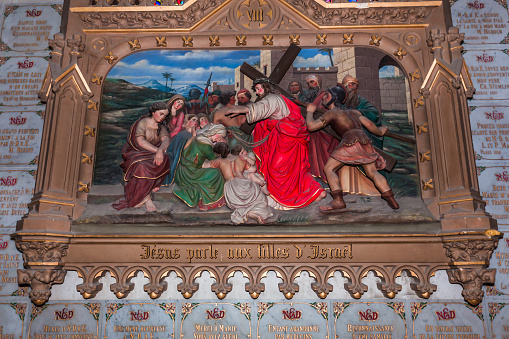 Chateauneuf sur cher, france, april 09, 2022 : station of the cross of Jesus Christ in  Our Lady of the Children basilica, manufactured by International Artistic Union of Vaucouleurs. year 1890