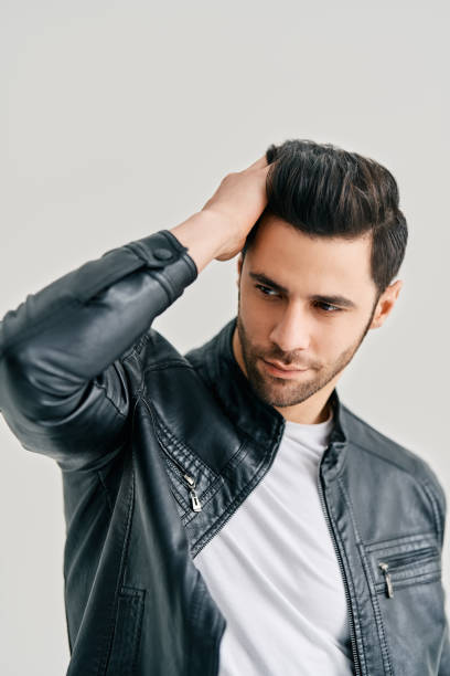 istock Confident handsome man in jacket his hair posing isolated on white background 1397722210