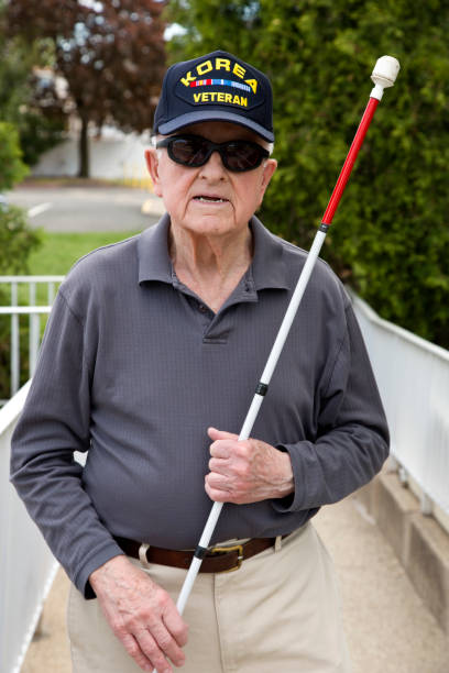 istock Blind Korean War veteran holding walking stick 1397723414