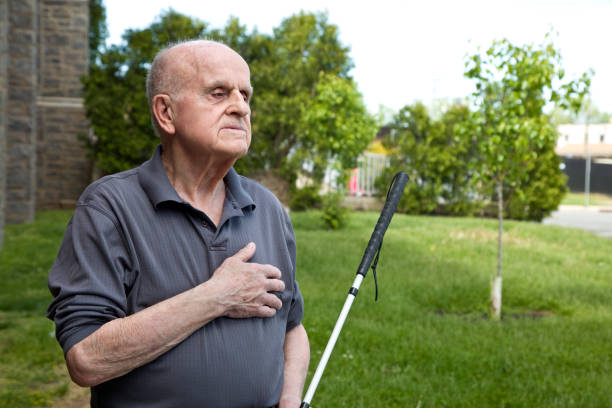 istock Blind man outdoors looking away hand over heart 1397723582