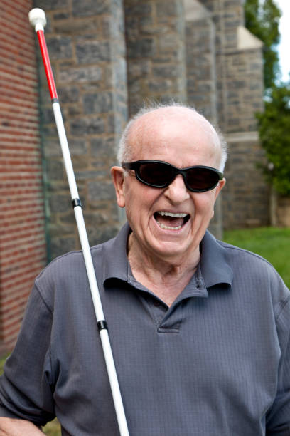 istock Blind man outdoors laughing heartily 1397723591