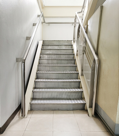 a checkered plate steel stair suitable to use in heavy traffic like the factory.