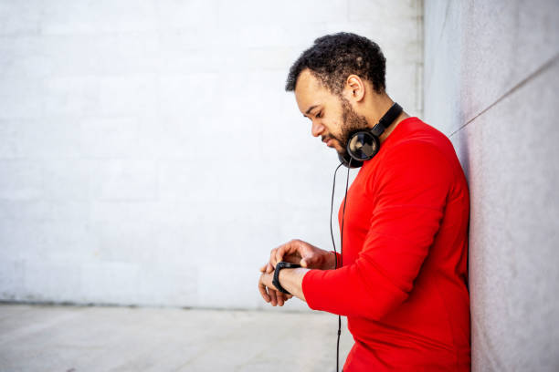 istock Man checking progress on smart watch after training outdoors 1397727747