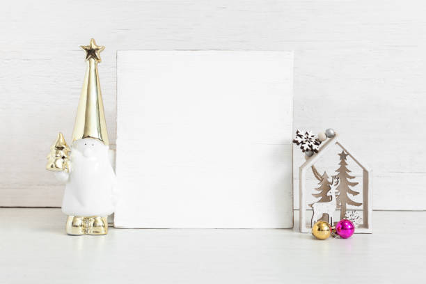 istock Square wooden sign mockup with christmas attributes. 1397728016