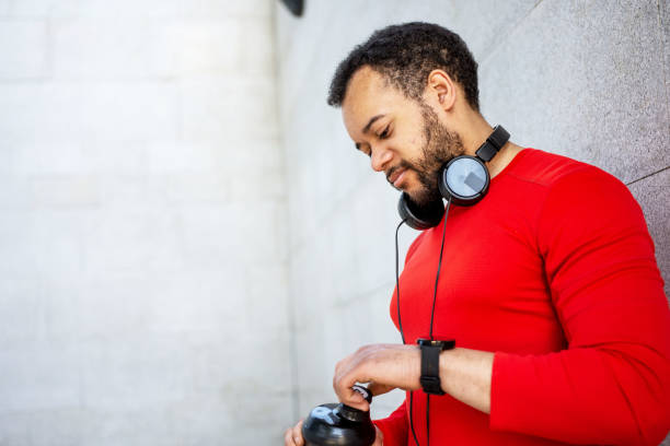 istock Portrait of a sporty young man drinking water while exercising 1397728535