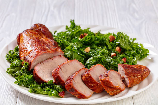 istock Roast Pork Tenderloin with kale salad on plate 1397729188