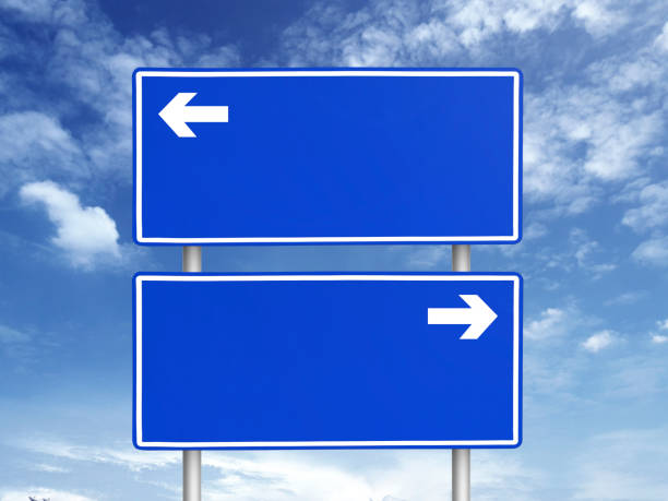 istock Empty road sign against a background of blue sky with clouds 1397729380