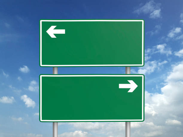 istock Empty road sign against a background of blue sky with clouds 1397729381