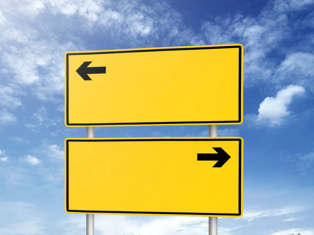 istock Empty road sign against a background of blue sky with clouds 1397729390