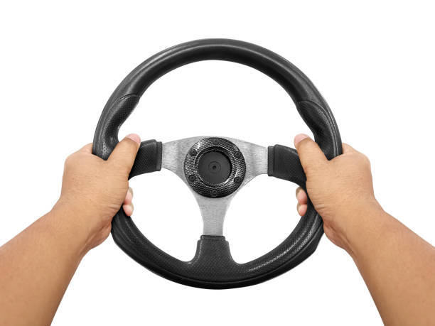 istock Hands holding steering wheel isolated on white 1397730587
