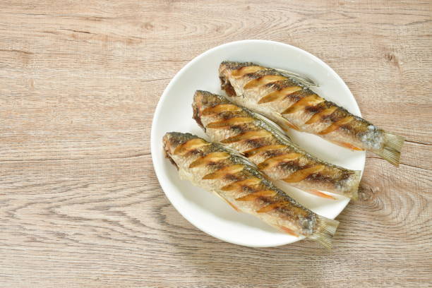 istock deep fried salty mullet fish on plate 1397732135