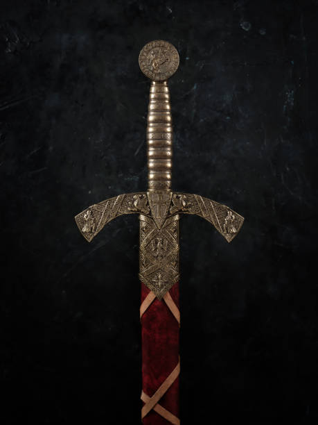 Vertical closeup of a knight's sword with a bronze handle