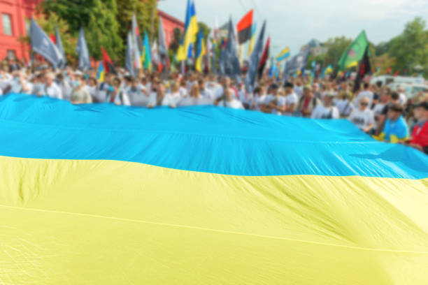 istock People with Ukrainian flag 1397732623
