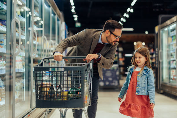 istock Dad and daughter grocery shopping 1397732755