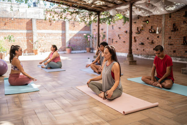 istock People doing lotus position in yoga class 1397733856
