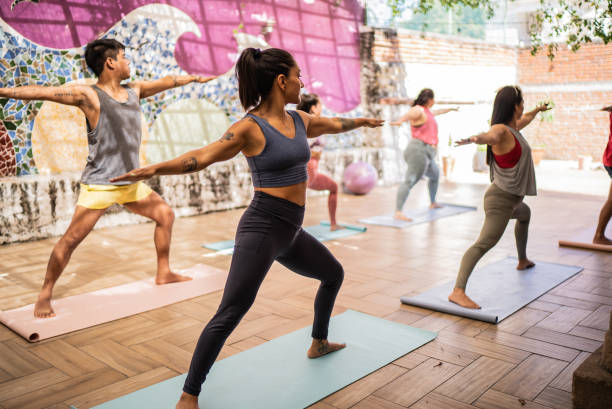 istock People in a yoga class 1397733979