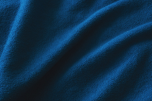 Blue colored fleece blanket background texture