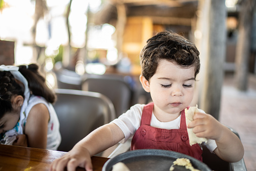 Little boy eating at a restaurant