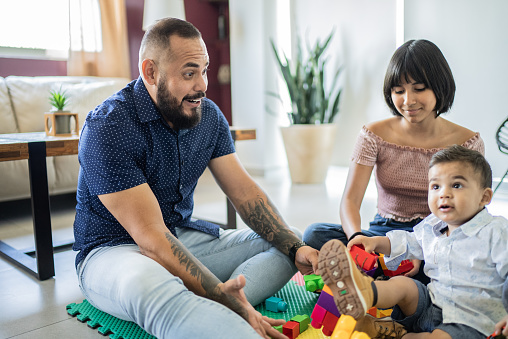 Father and kids playing at home