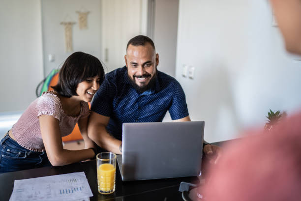 istock Father and daughter using the laptop at home 1397737614