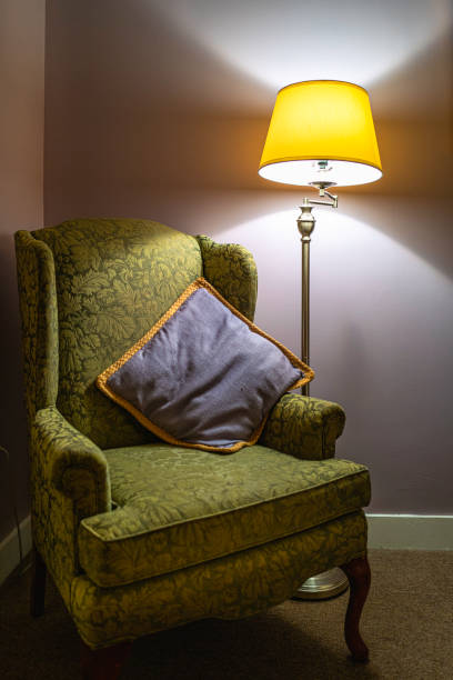 istock Vintage retro-style interior armchair with light stand and pillow 1397737722