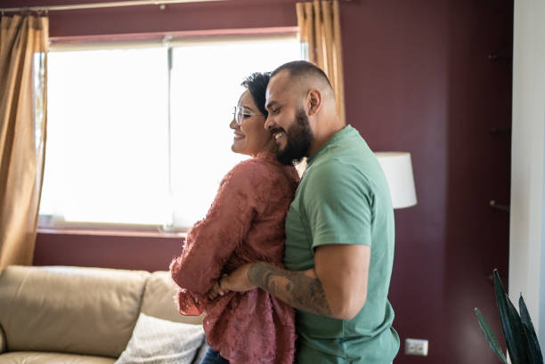 istock Mid adult couple dancing at home 1397738459
