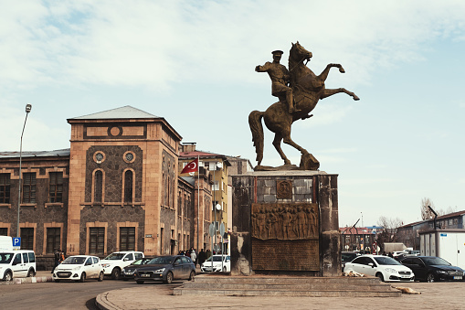 Kars, Turkey - February 23, 2022: Ataturk statue with a horse at Inonu avenue Kars Turkey