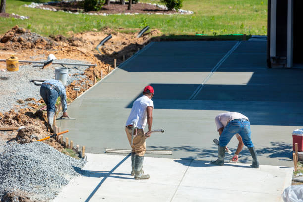 Hispanic men working on a new concrete driveway New Hill, North Carolina, USA: 1st June 2020; Unidentifiable Hispanic men working on a new concrete driveway at a residential home driveway stock pictures, royalty-free photos & images