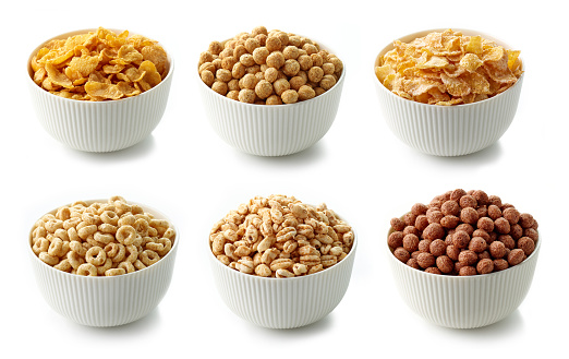 bowls of various breakfast cereal isolated on white background