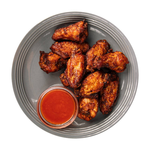 Isolated portion of baked chicken wings