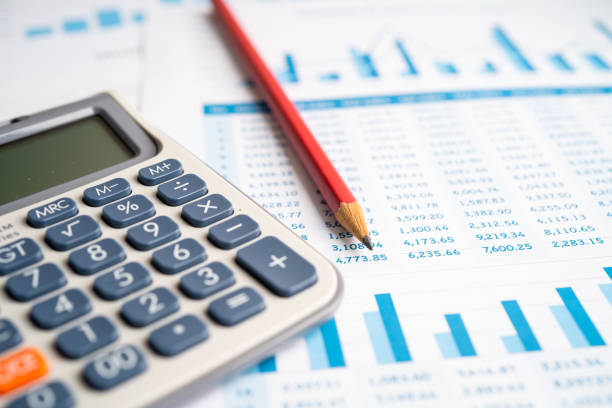 istock Calculator on chart and graph spreadsheet paper. Finance development, Banking Account, Statistics, Investment Analytic research data economy, Stock exchange trading, Business company concept. 1397741181