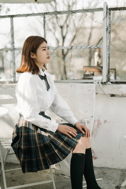 istock A girl in school uniform 1397741319