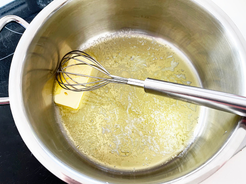close-up of butter melting in sauce pan