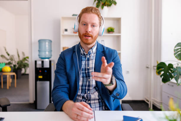 istock Man having online meeting while working in an office 1397742973