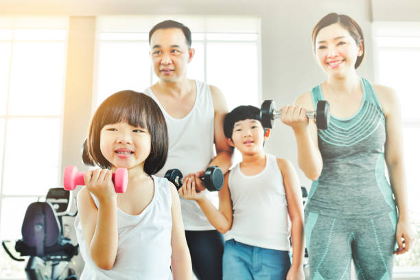 istock Happy family exercising 1397746676