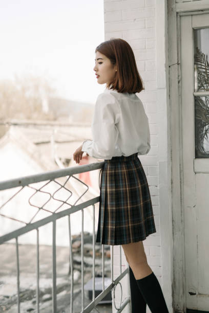 istock A girl in school uniform 1397747885