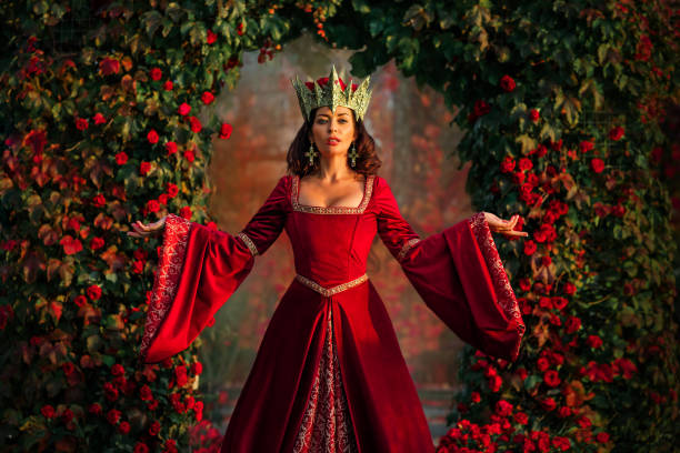 A beautiful brunette queen in a public rose garden setting