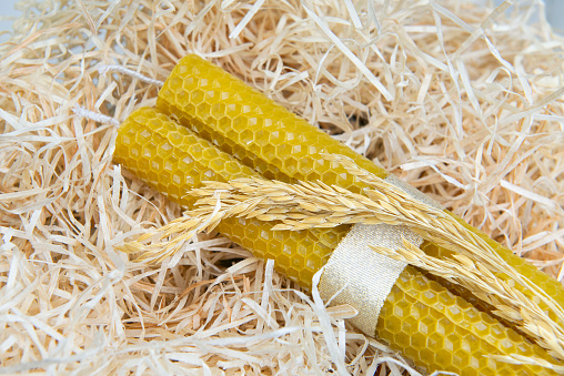 Two Beeswax Candles with a ribbon and wheat