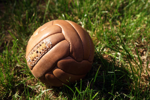 istock Retro soccer ball on grass 1397749187