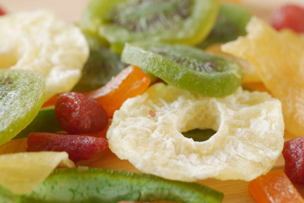 top-down view of assorted fruit cups, each filled with a variety of fresh, colourful fruits neatly arranged in clear plastic containers.