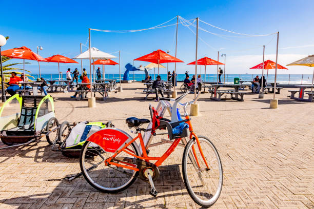 Cape Town, South Africa - May 12, 2022: Bicycle rental business on Sea Point beach front
