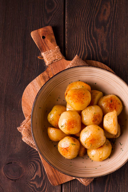 istock Fresh Cooked, new potatoes,with dill, on a wooden table, selective focus. close-up, toning, no people, 1397754329