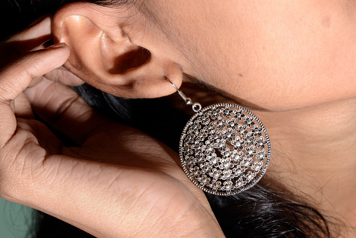 Ear ring worn by a young Indian girl