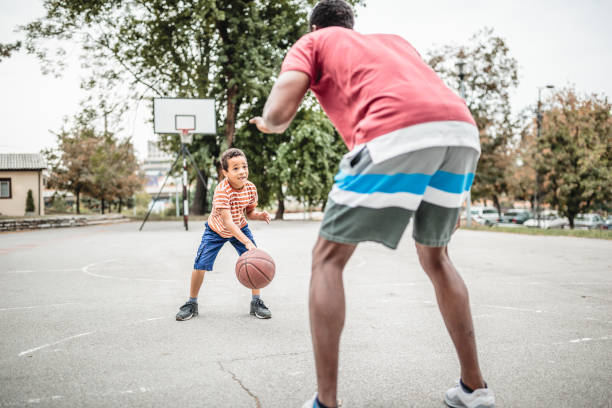 istock Father and son playing basketball 1397756054