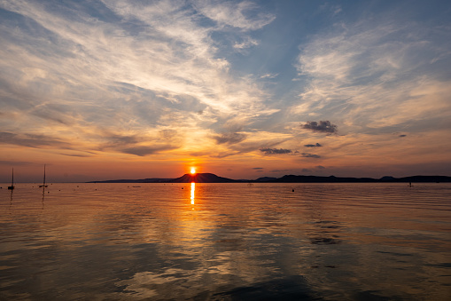 Sunset over the lake Balaton, with the view of Badacsony hill