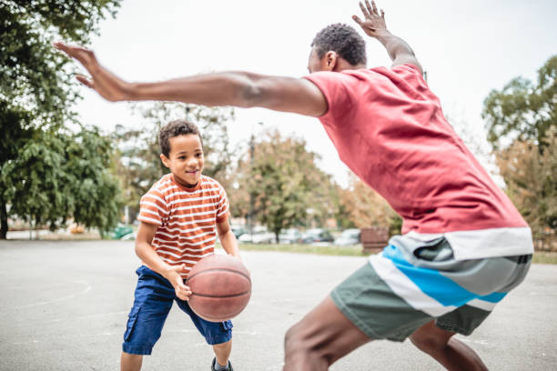 istock Father and son playing basketball 1397756193