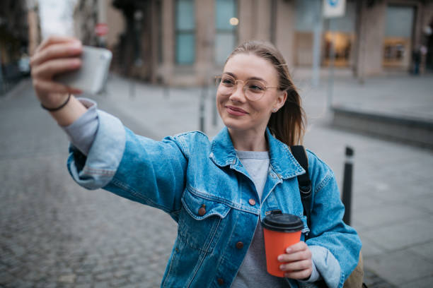 istock Happy young woman using a smart phone 1397756770