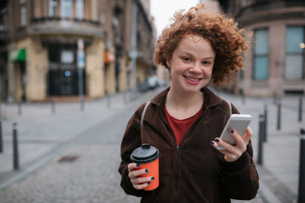 istock Happy young woman using a smart phone 1397756789