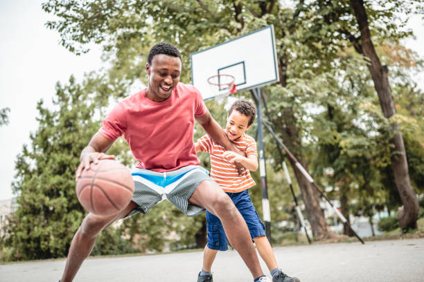 istock Father and son playing basketball 1397756838