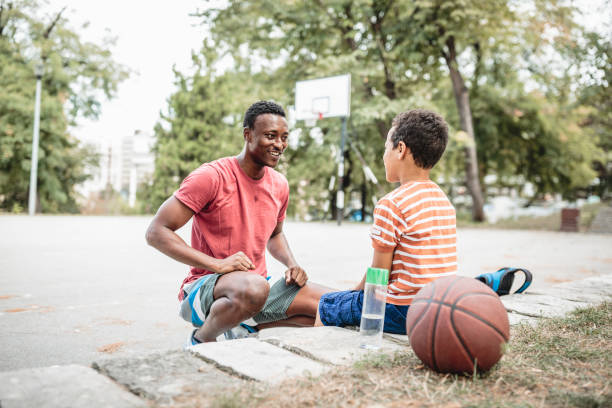 istock Father and son playing basketball 1397756915
